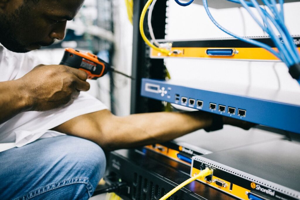 Hritika Services technician installing network equipment